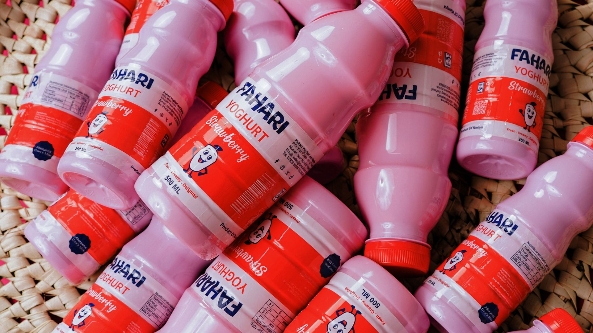 Pouring Fahari yoghurt with fresh fruit